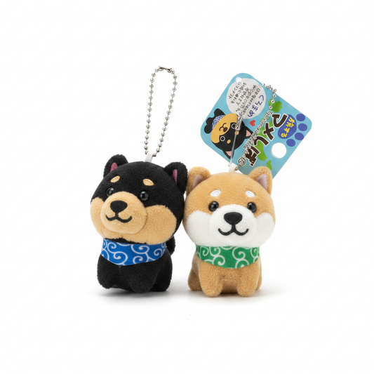 Black and tan Mameshiba plushie keychains together with Tabisuru Mameshiba tag