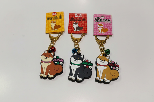 All 3 Shiba Inu Japan rubber keychains front view — tan, black and golden with bells on white background